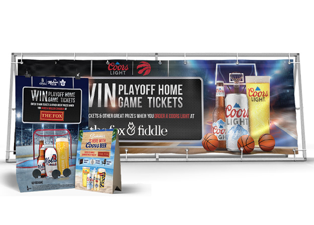 Basketball game ticket display with banner and drink